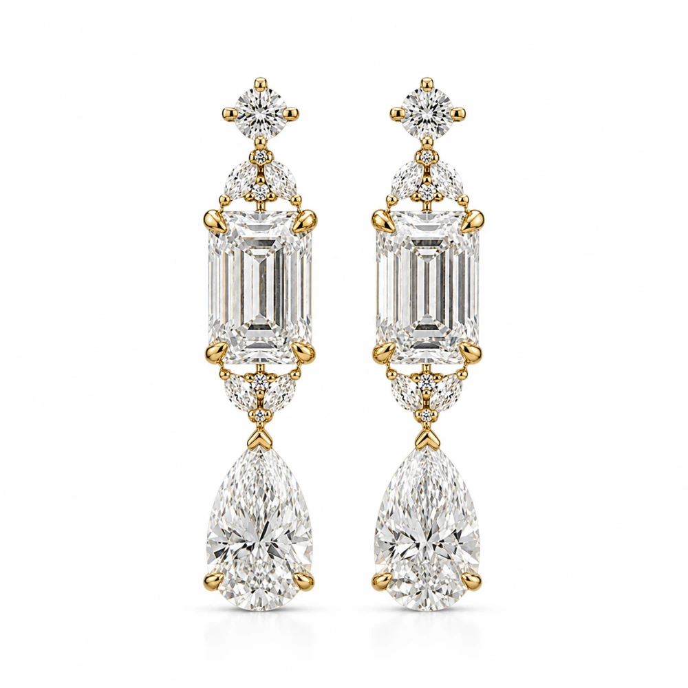 The Emerald Cascade Drops — Sepasang · Emerald cut 0,70 ct + pear 0,90 ct per sisi · Aksen 0,05 ct & 0,02 ct · ±3,80 ct total · Emas 18K